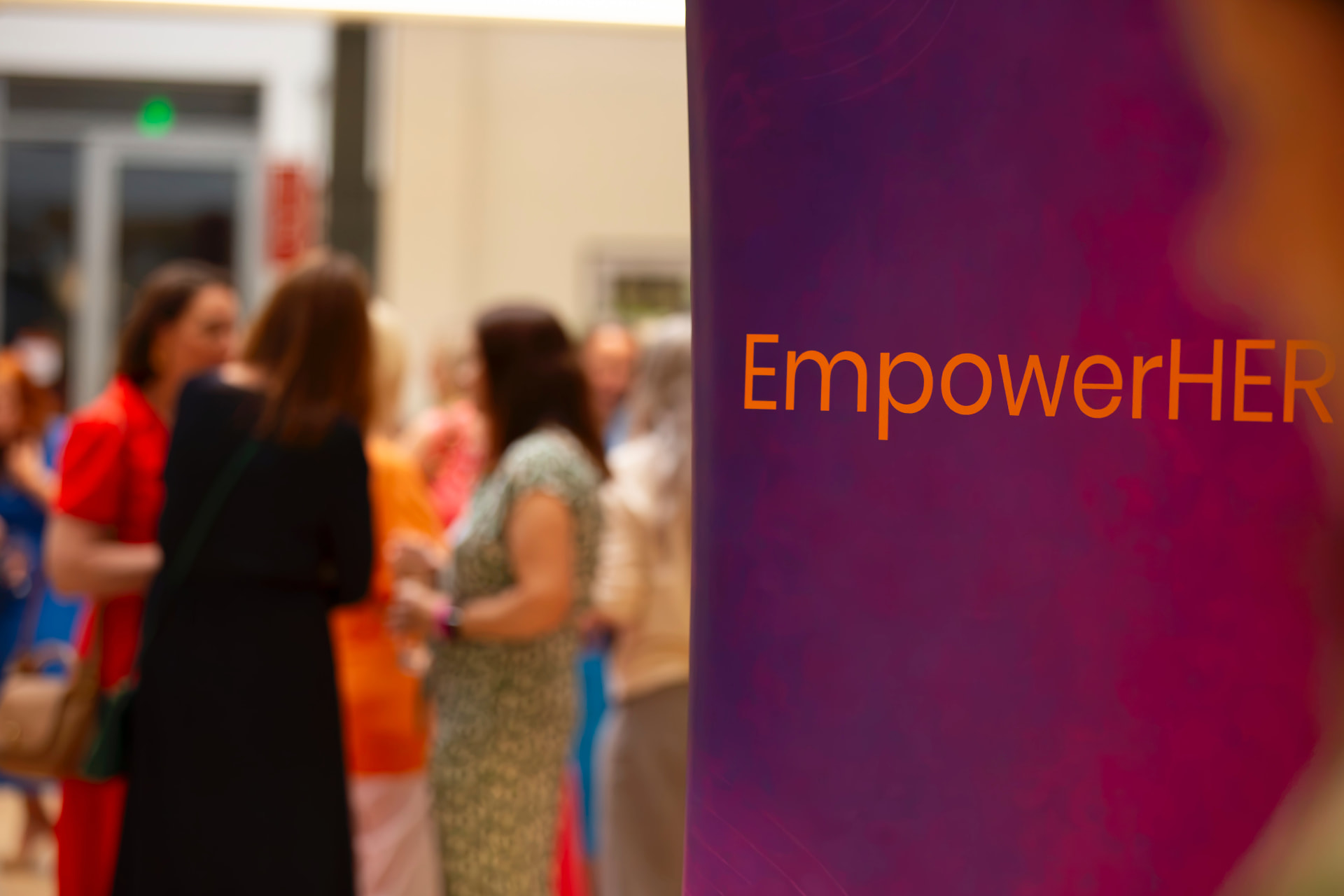 Women in conversation at an EmpowerHER event